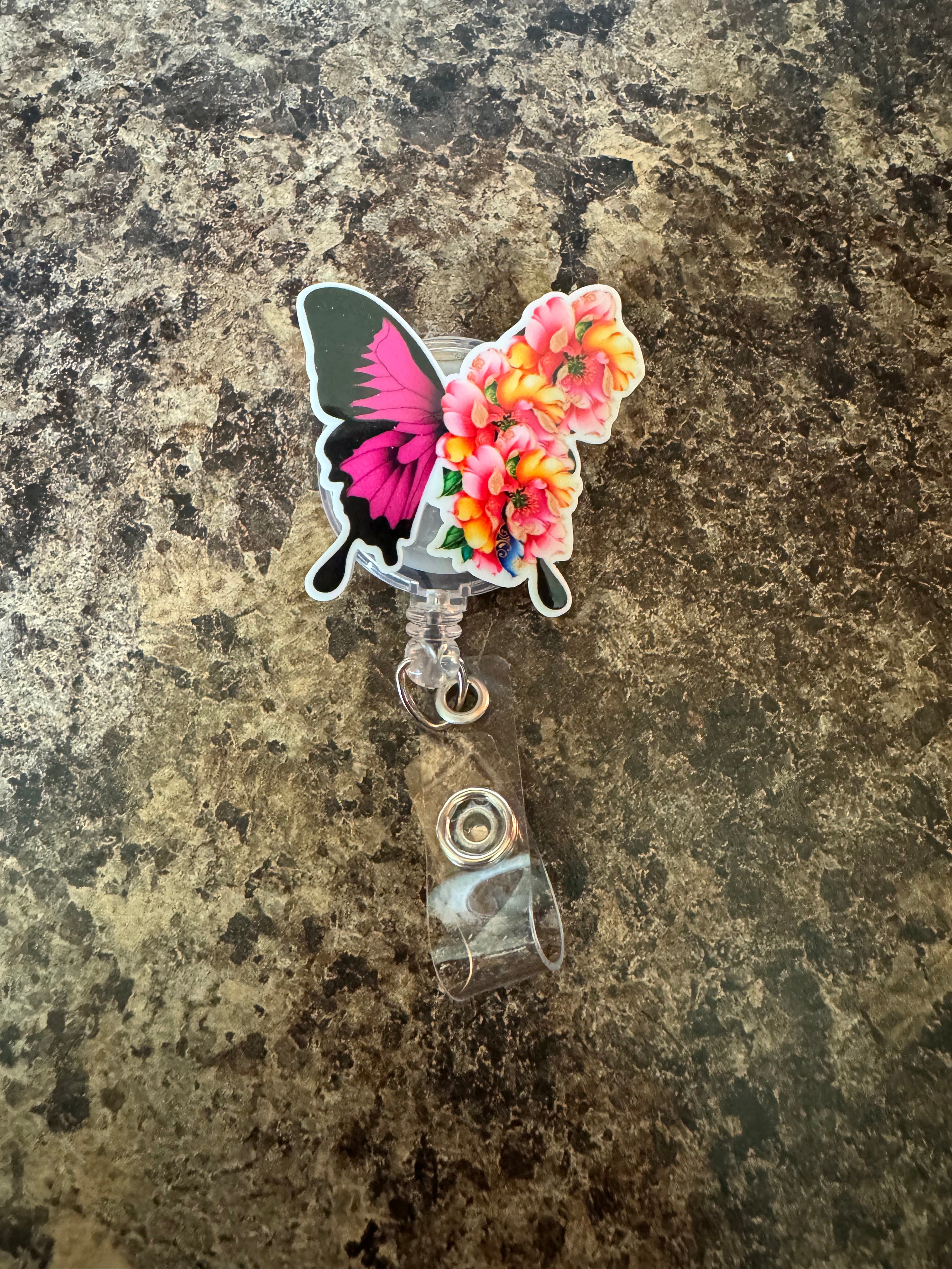 Floral butterfly badge reel