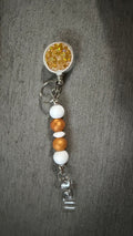Gold jeweled beaded badge reel