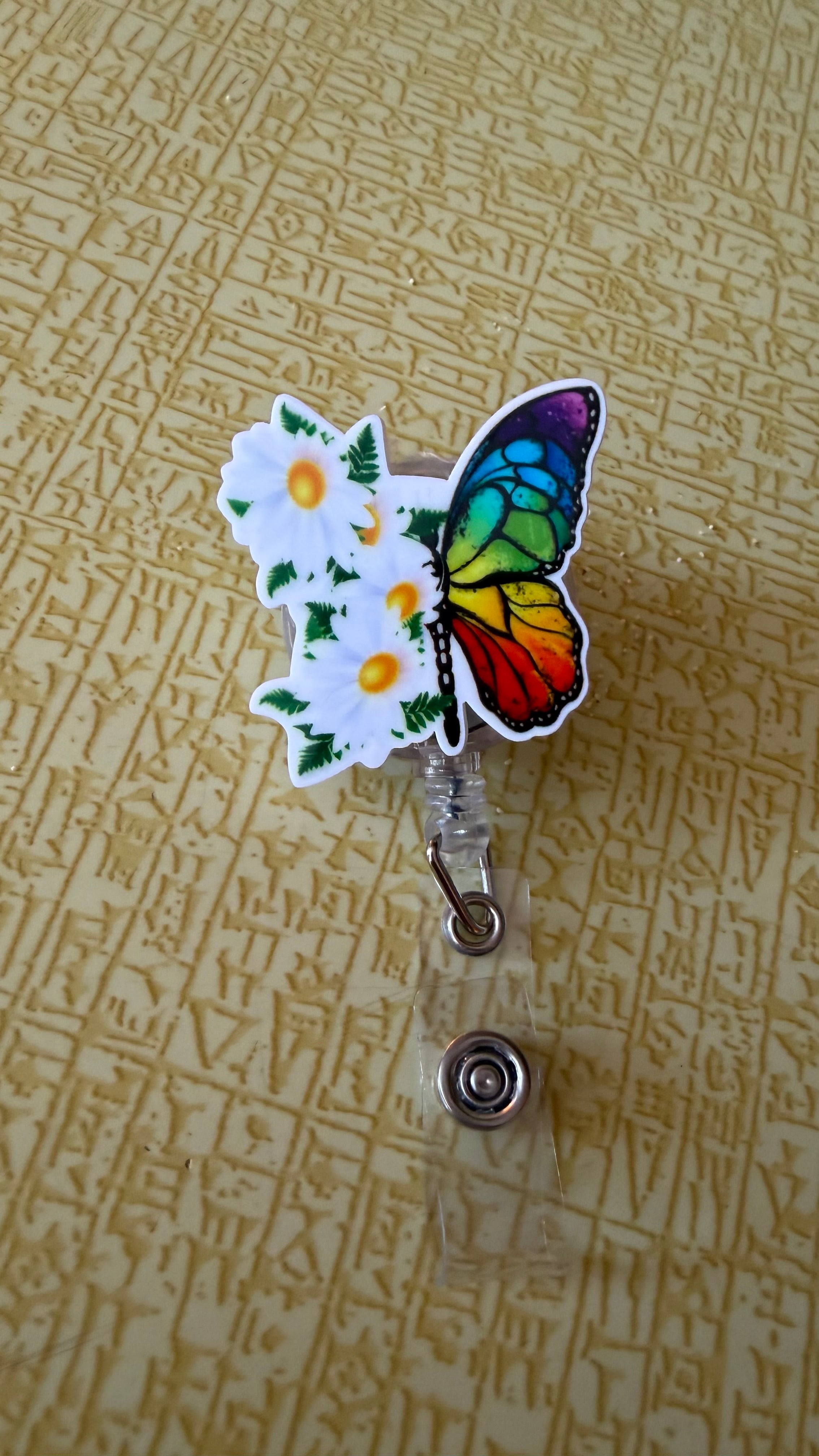 Rainbow flower butterfly badge reel
