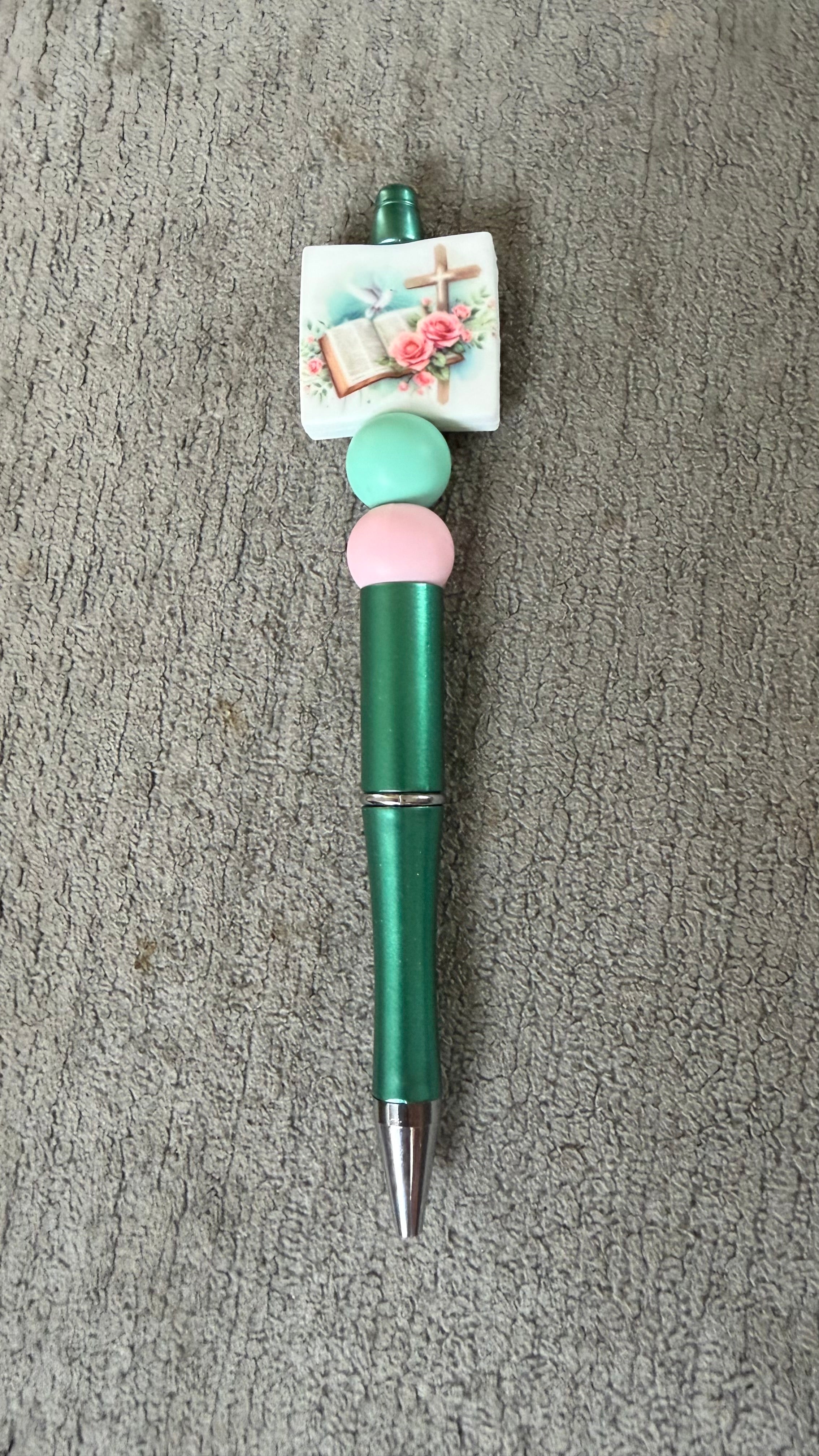 Bible and cross pen