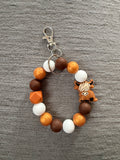 Brown hyland cow wristlet