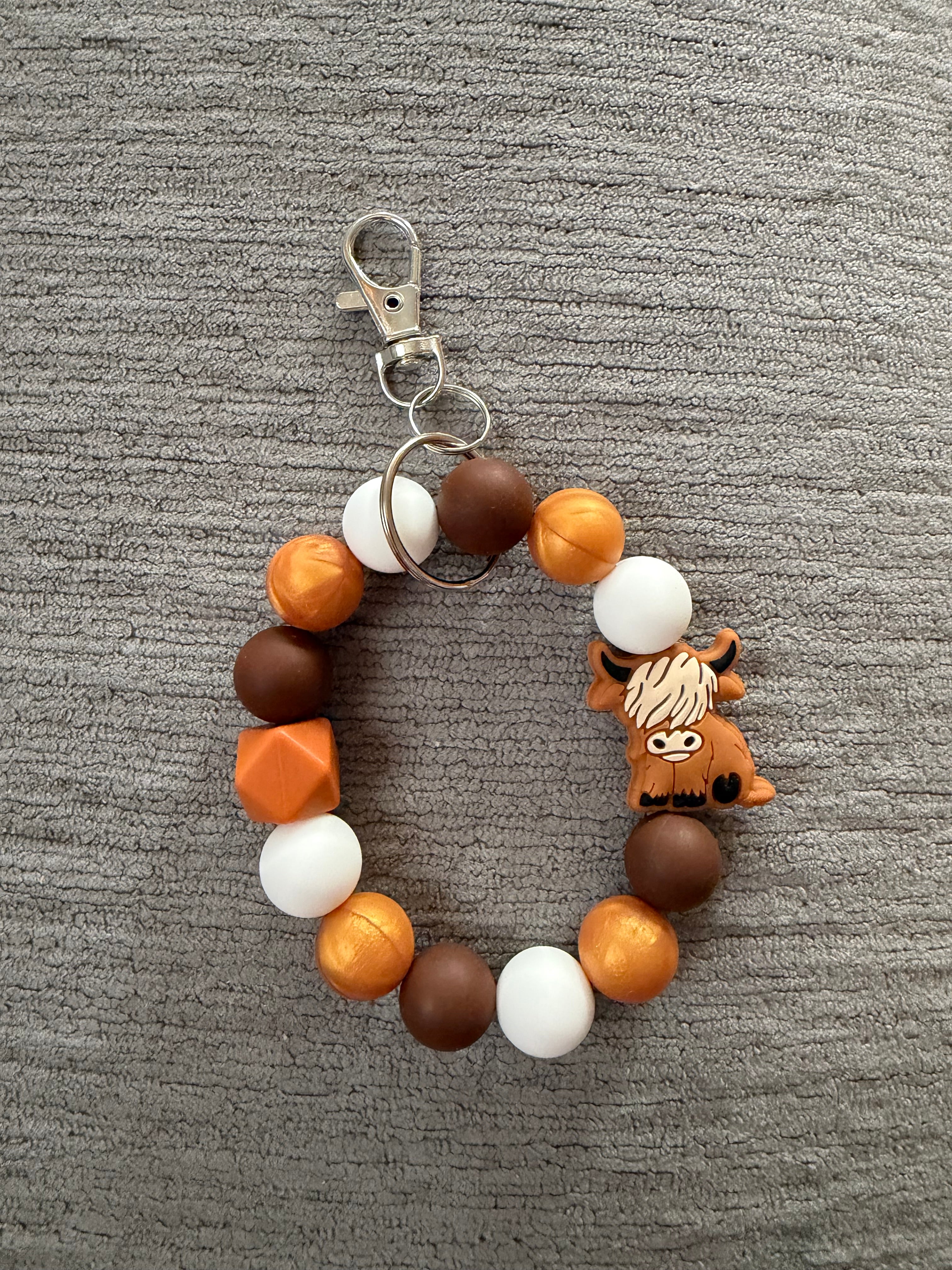 Brown hyland cow wristlet