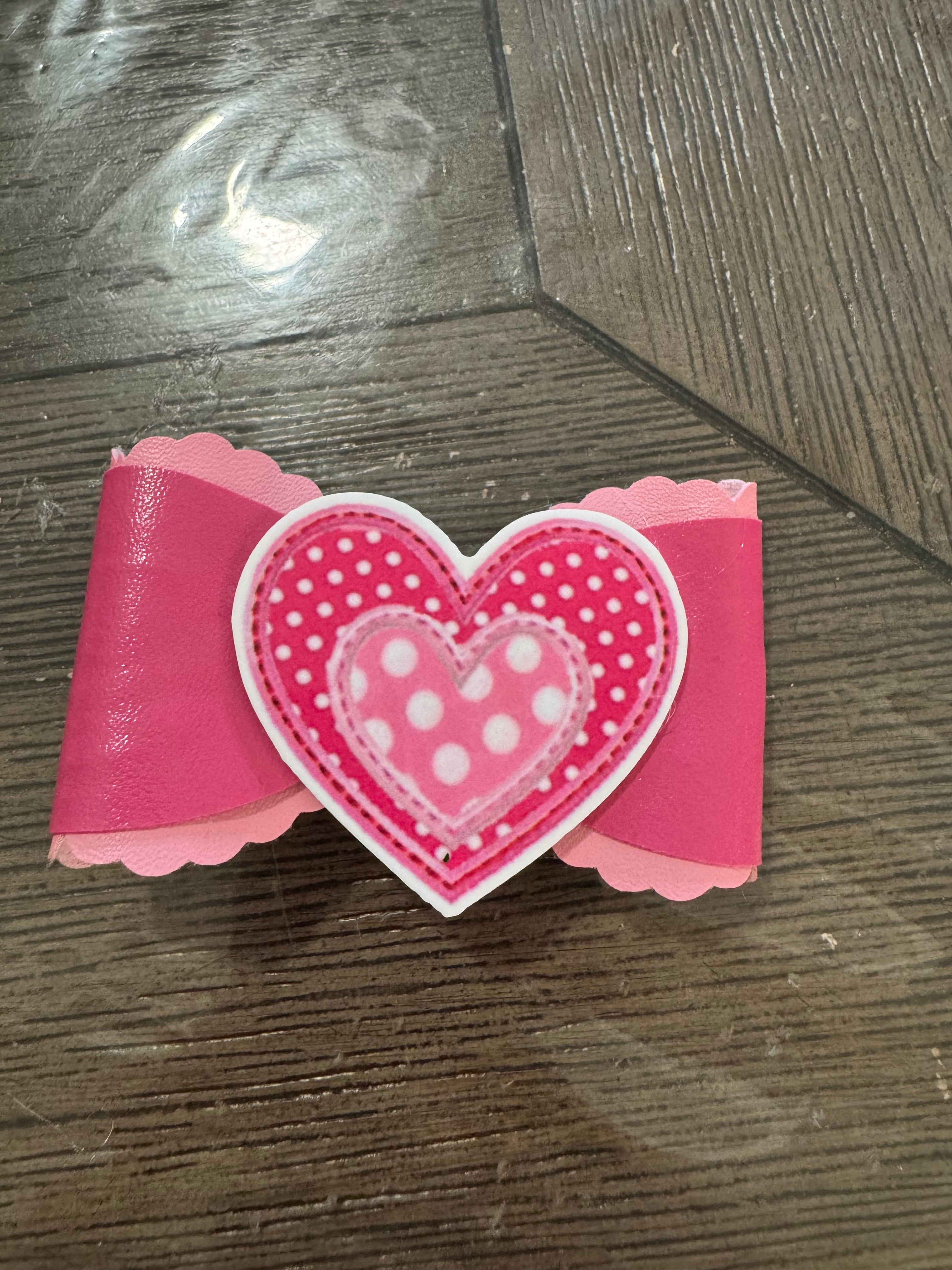 Pink heart overlay bow clip