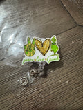 Peace love green badge reel