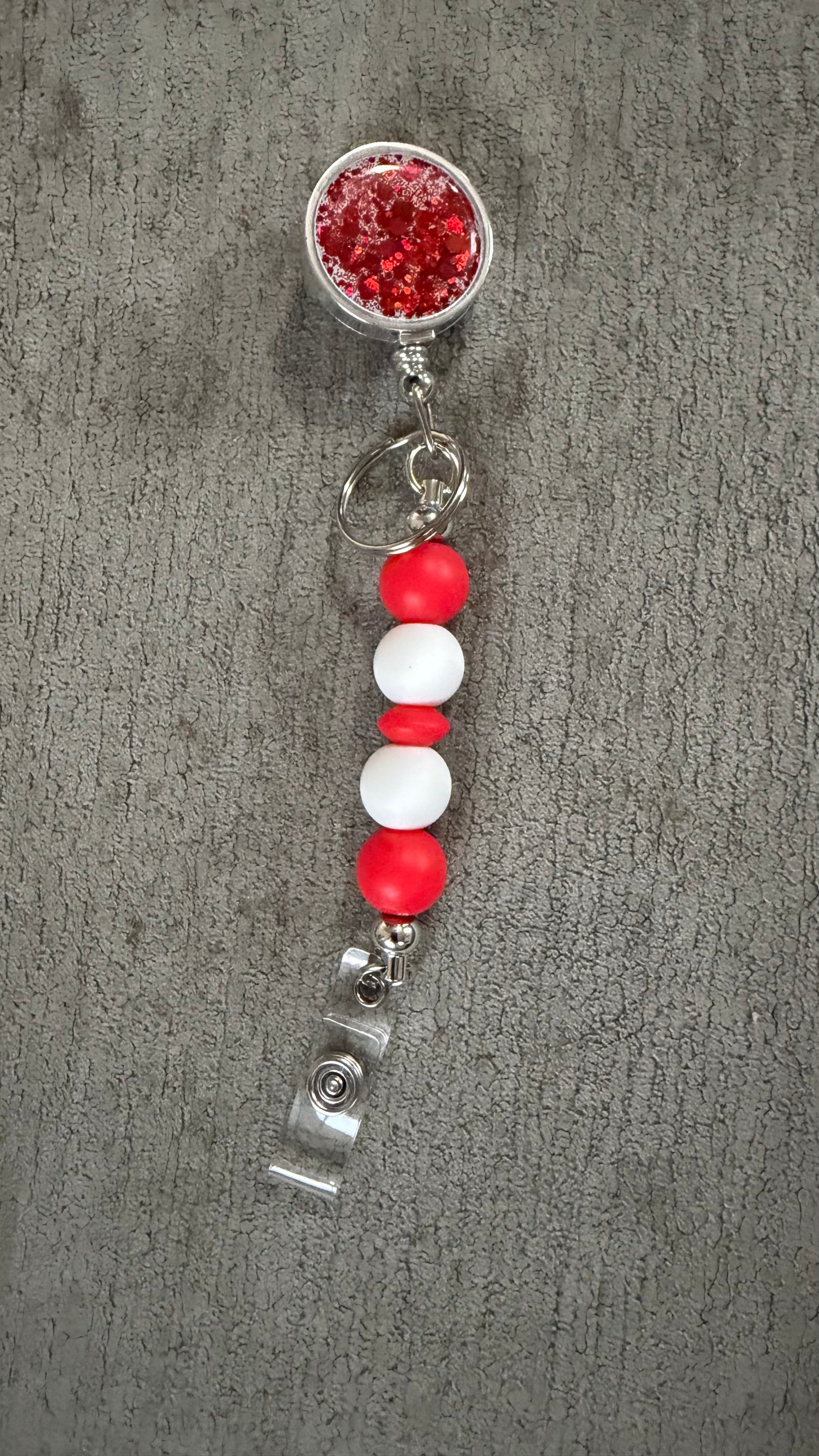 Red jeweled beaded badge reel