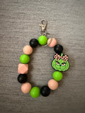 Pumpkin green guy wristlet