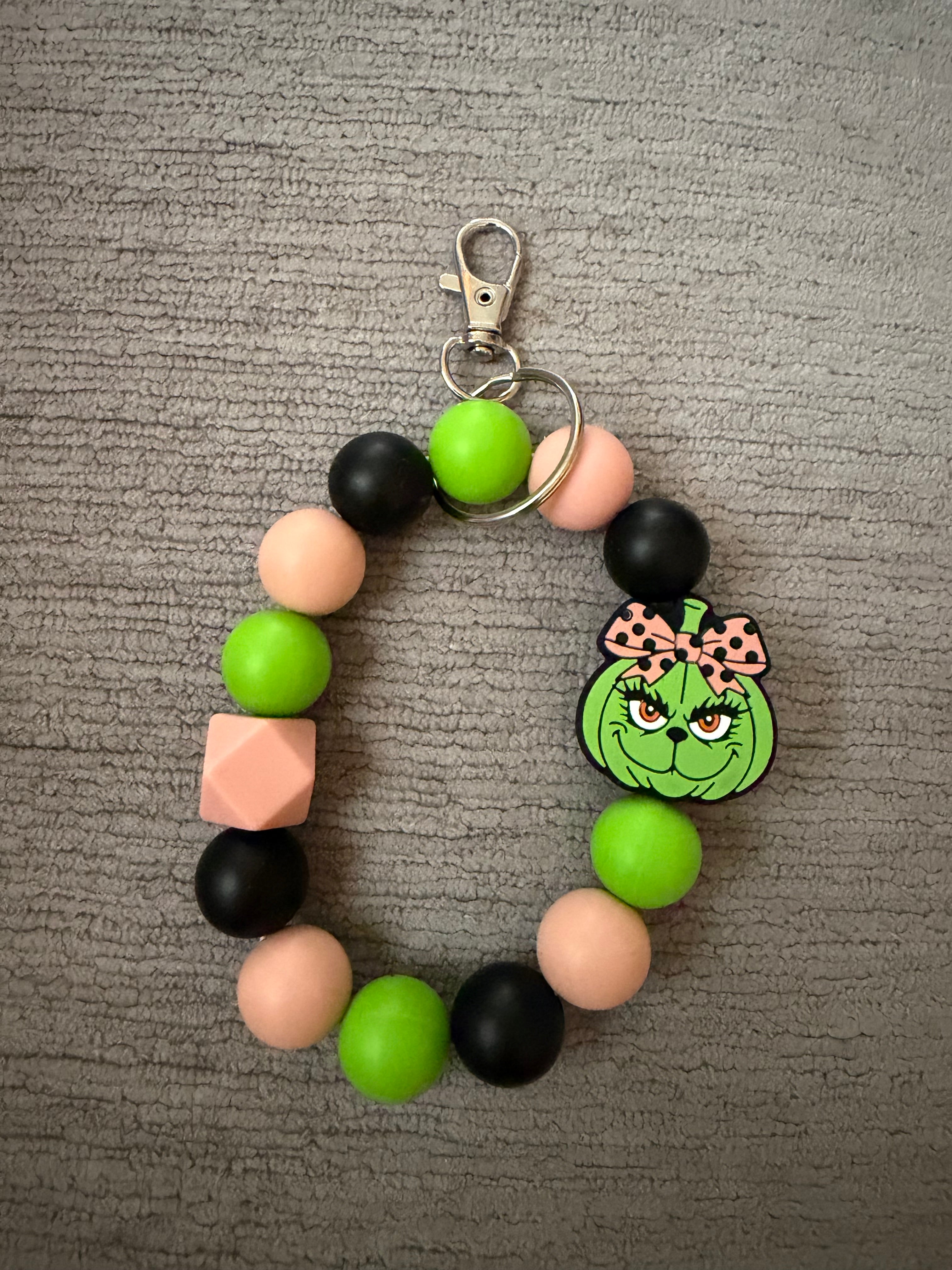 Pumpkin green guy wristlet