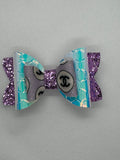 Purple sparkle clip bow