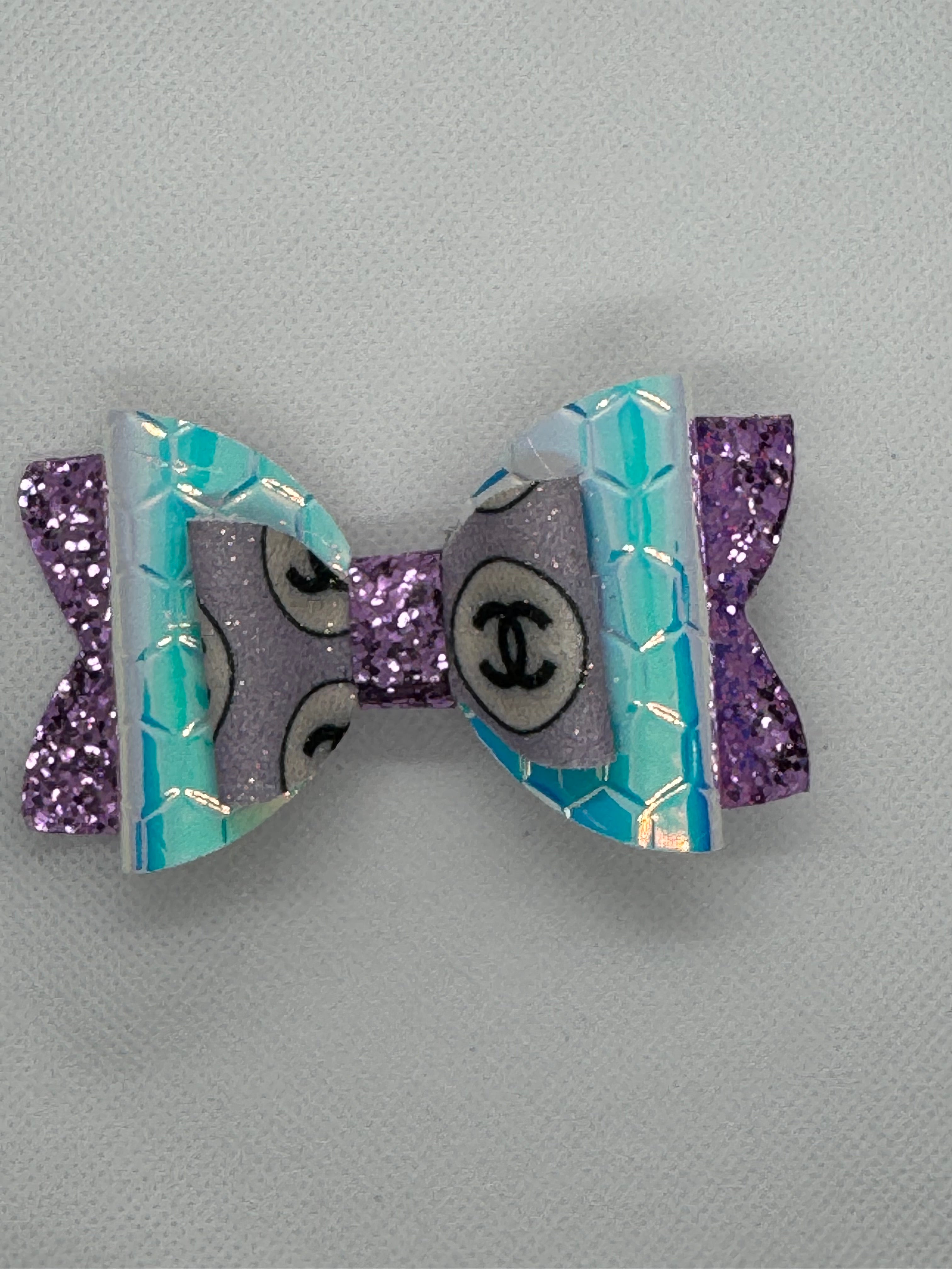 Purple sparkle clip bow