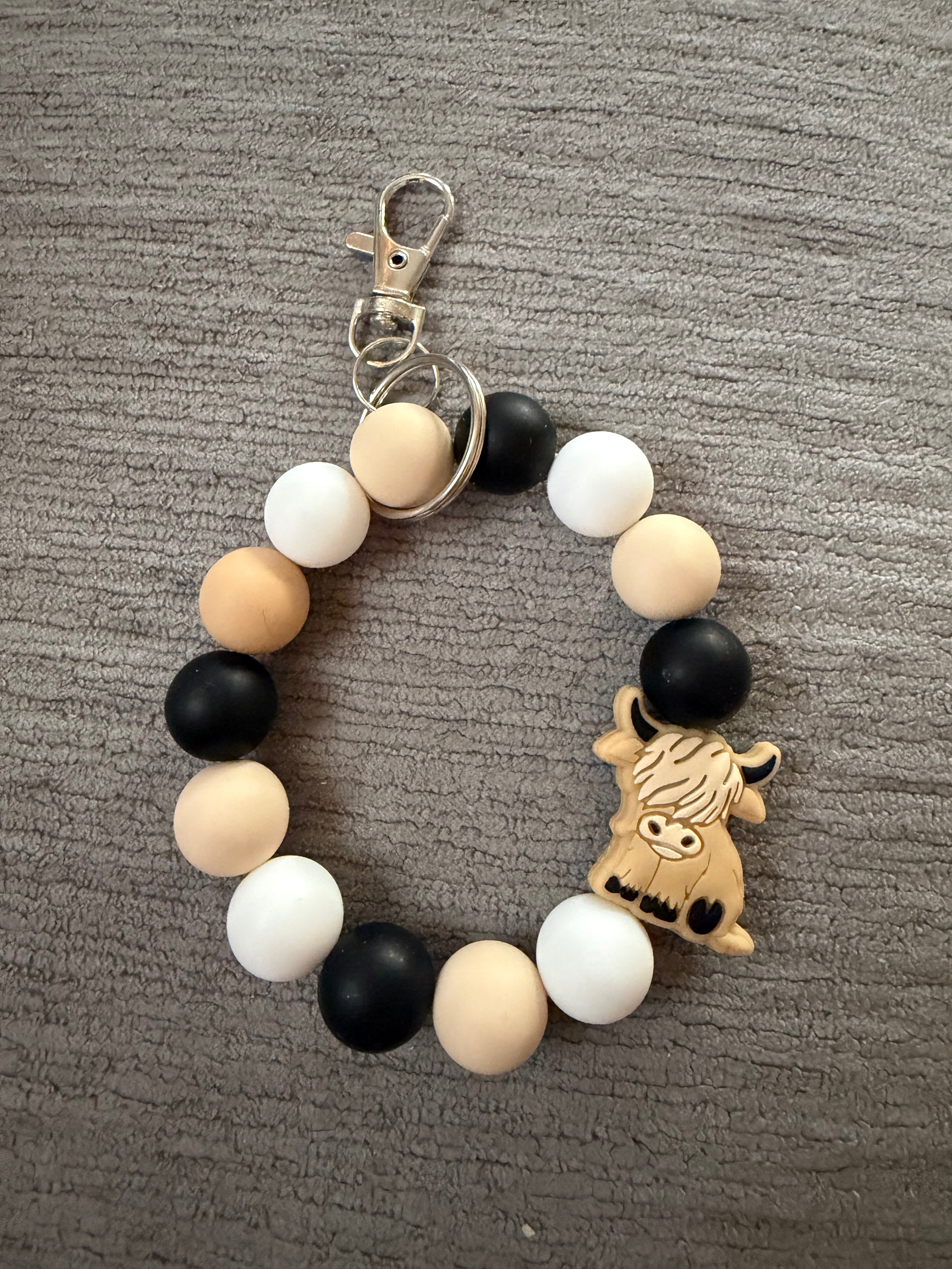 Tan hyland cow wristlet