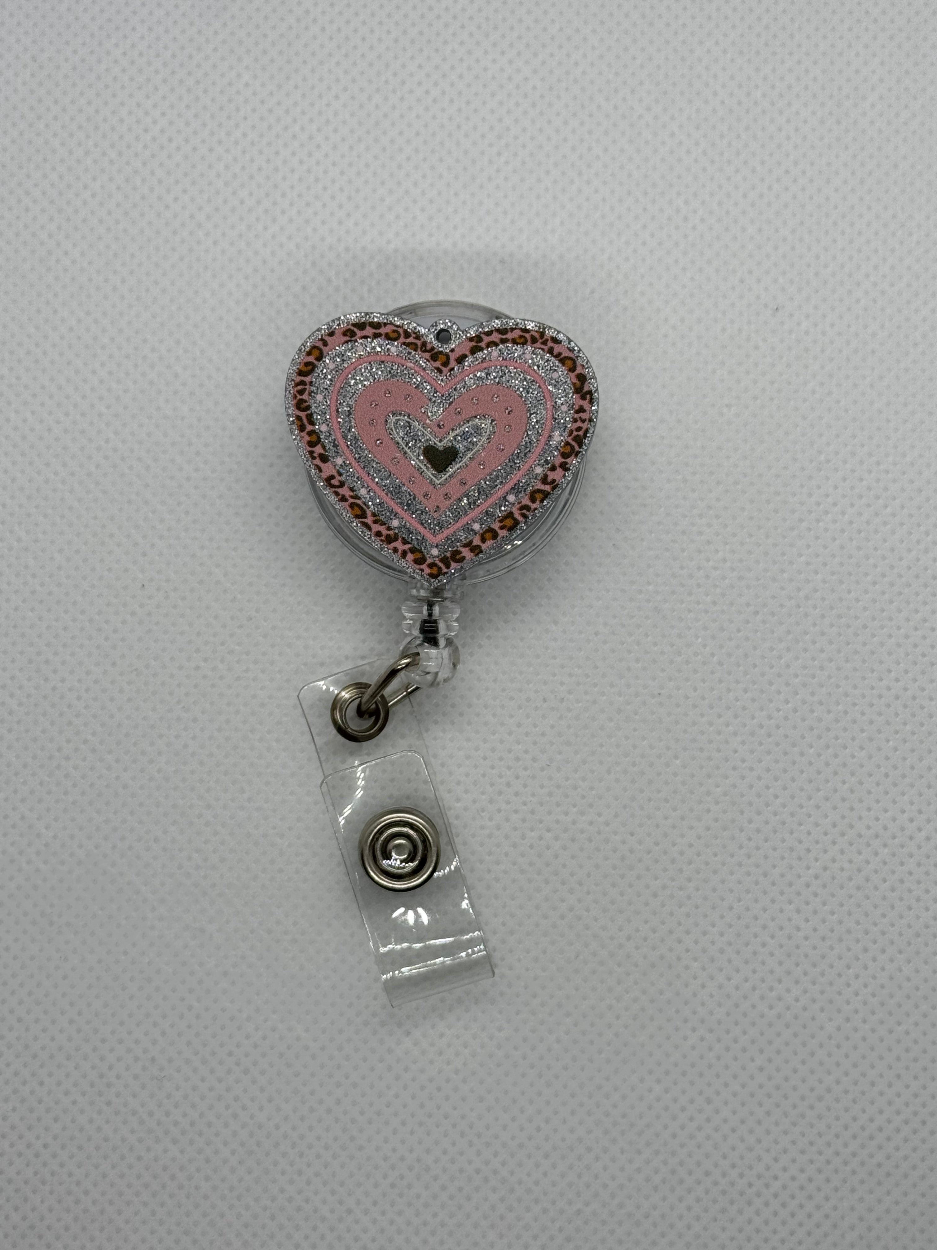 Pink heart badge reel