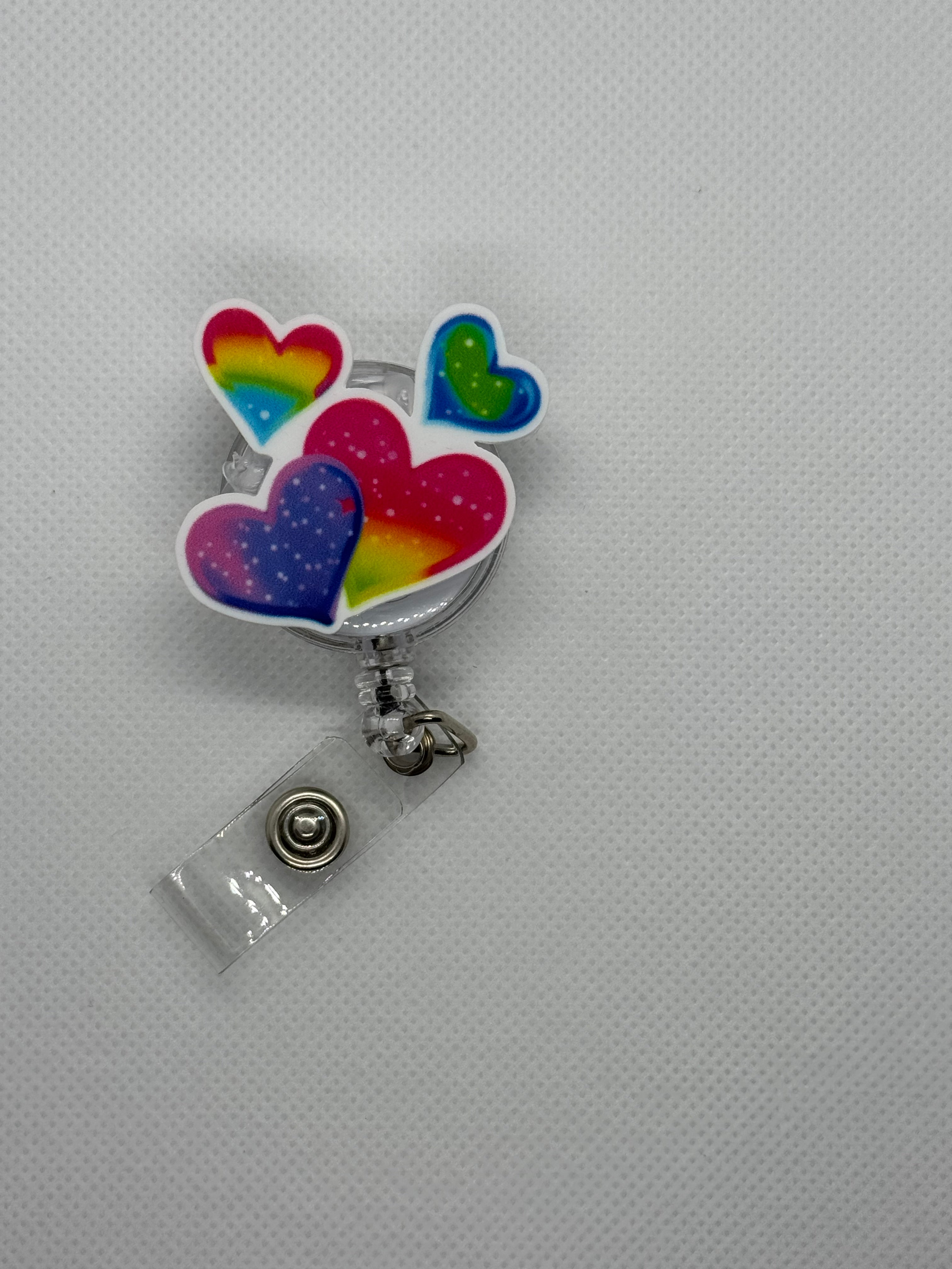 Rainbow heart badge reel