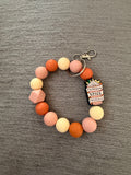 Pumpkin spice wristlet