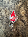 Gnome and flowers badge reel
