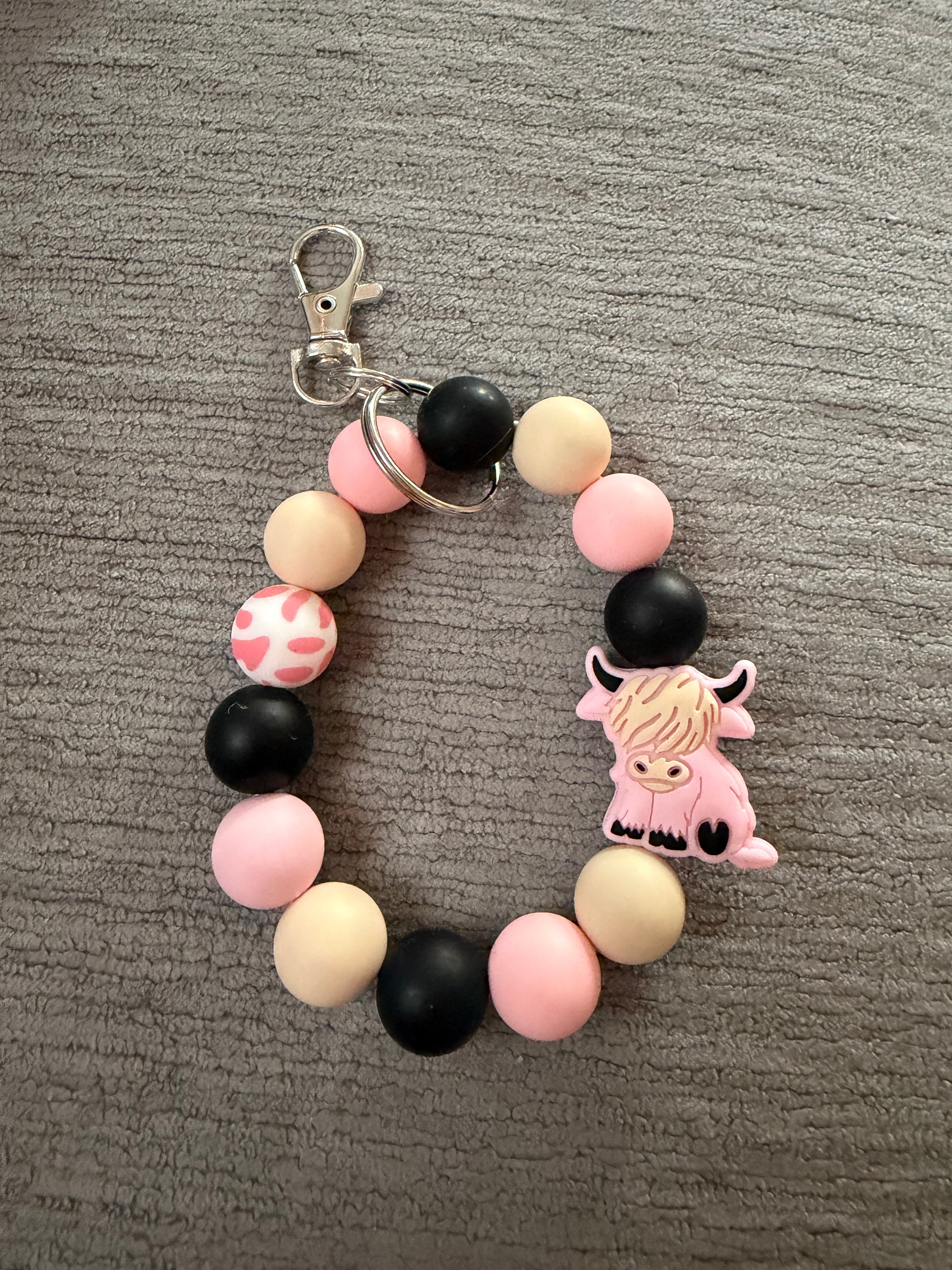 Pink hyland cow wristlet