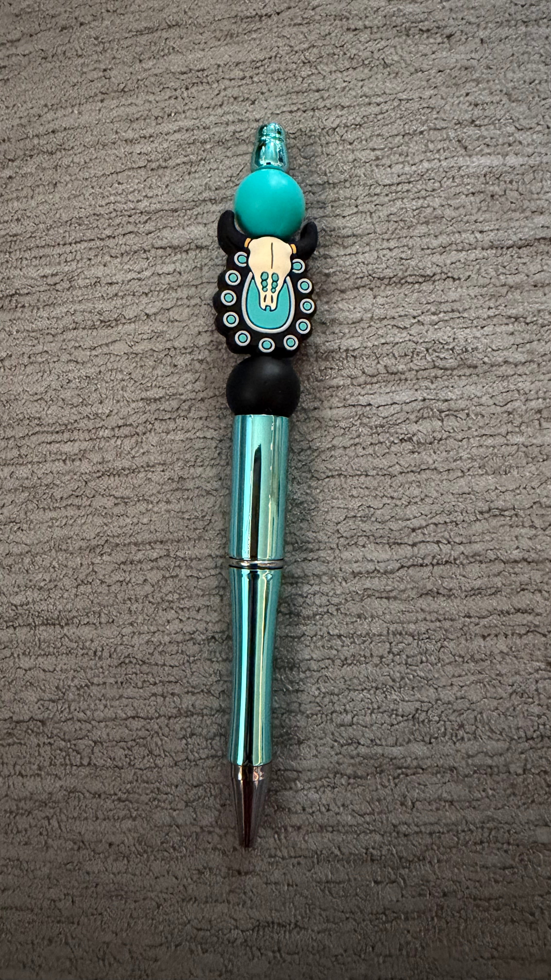 Teal skull pen