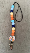 Blue dog pacifier clip
