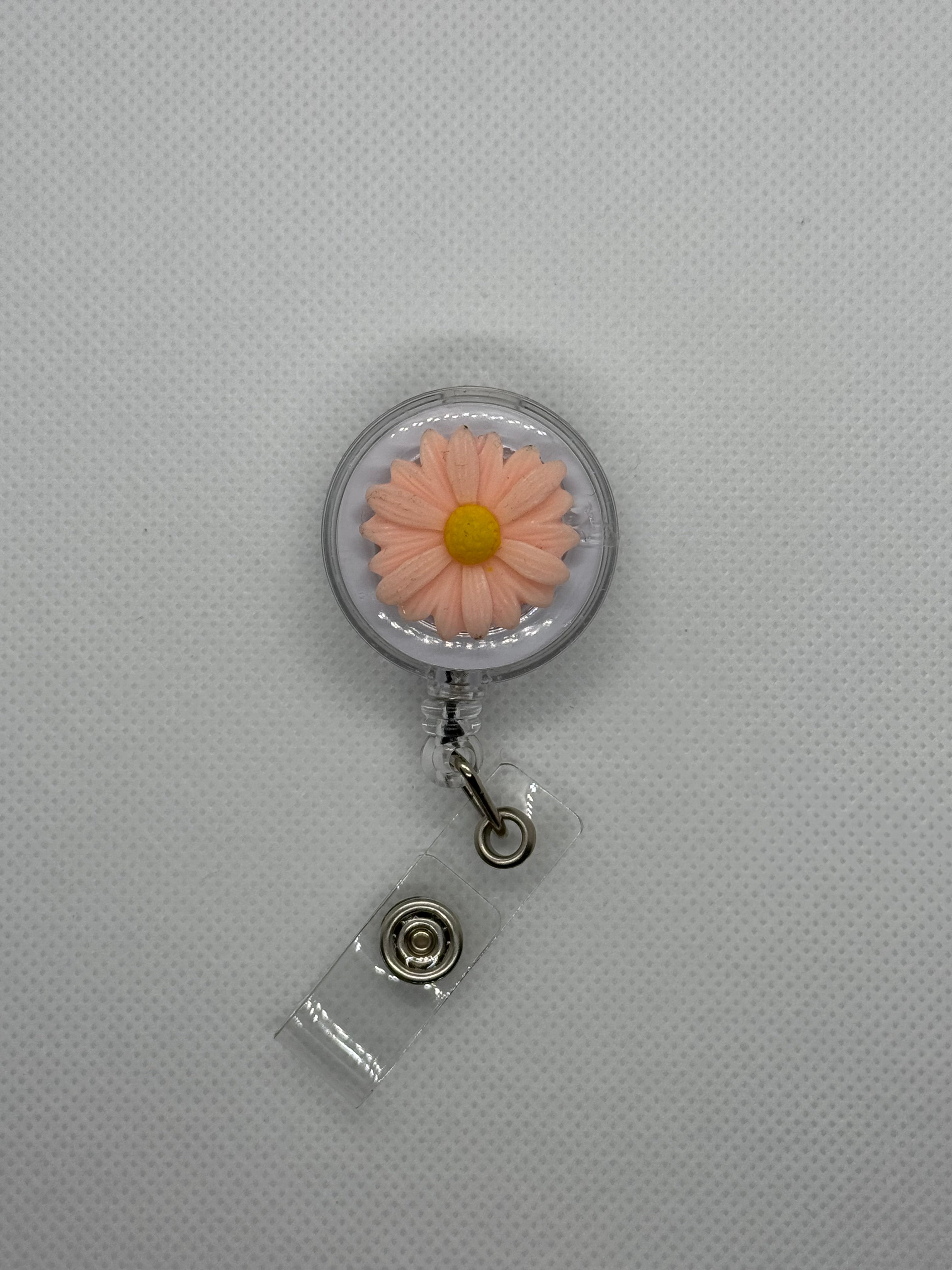 Pink daisy badge reel