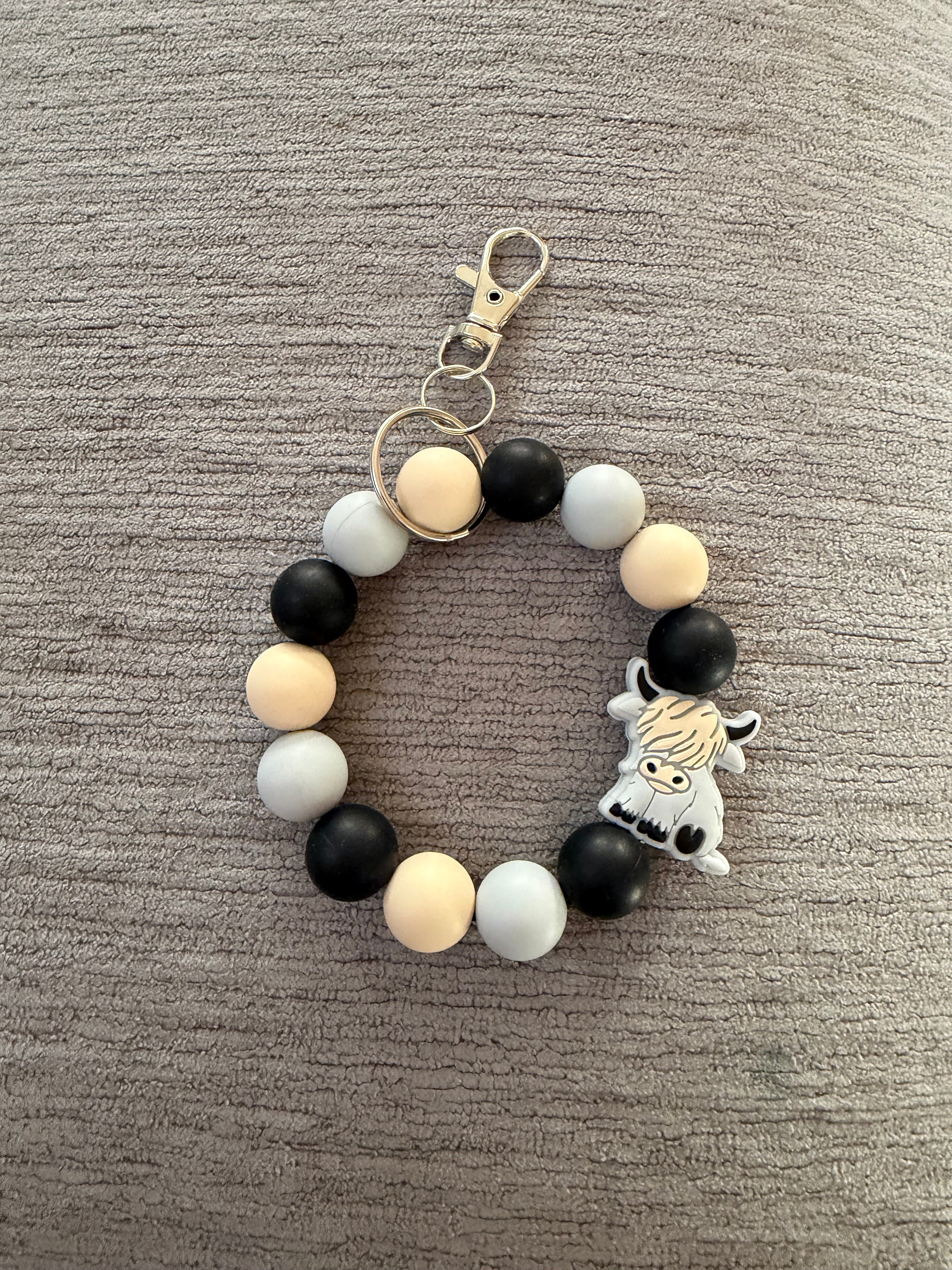 Brownish grey moo moo wristlet