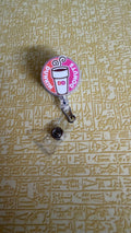 Pink and orange coffee badge reel